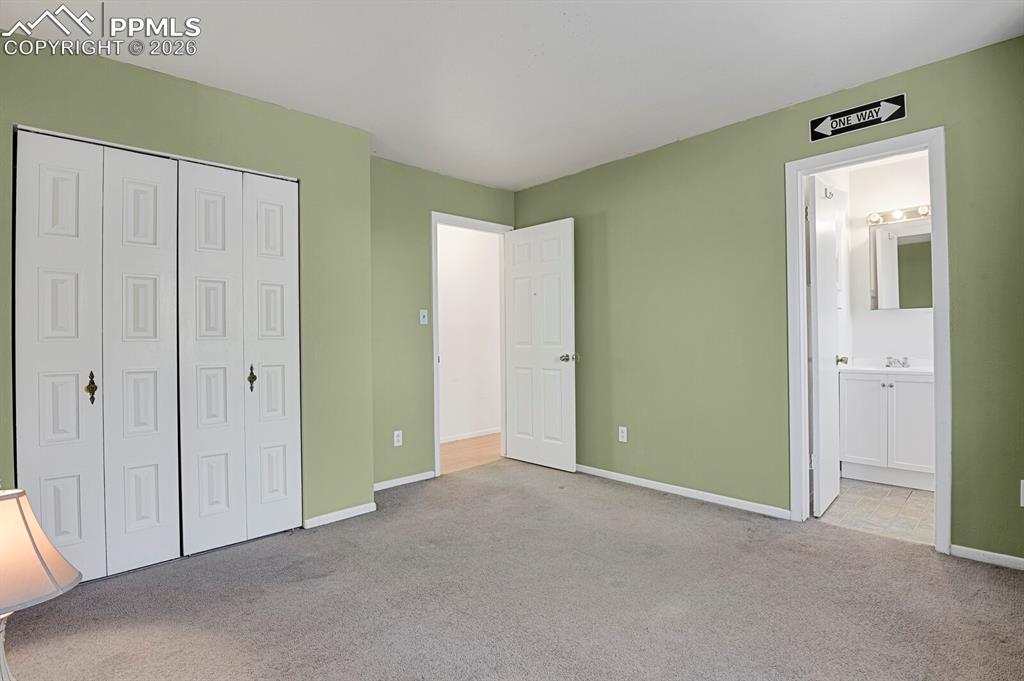 Image 12 of 29: Bedroom #1 with en suite Half Bath
