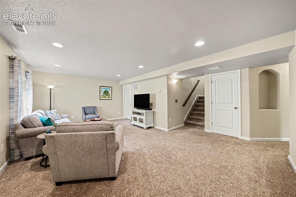 Image 17 of 32: Expansive basement family room