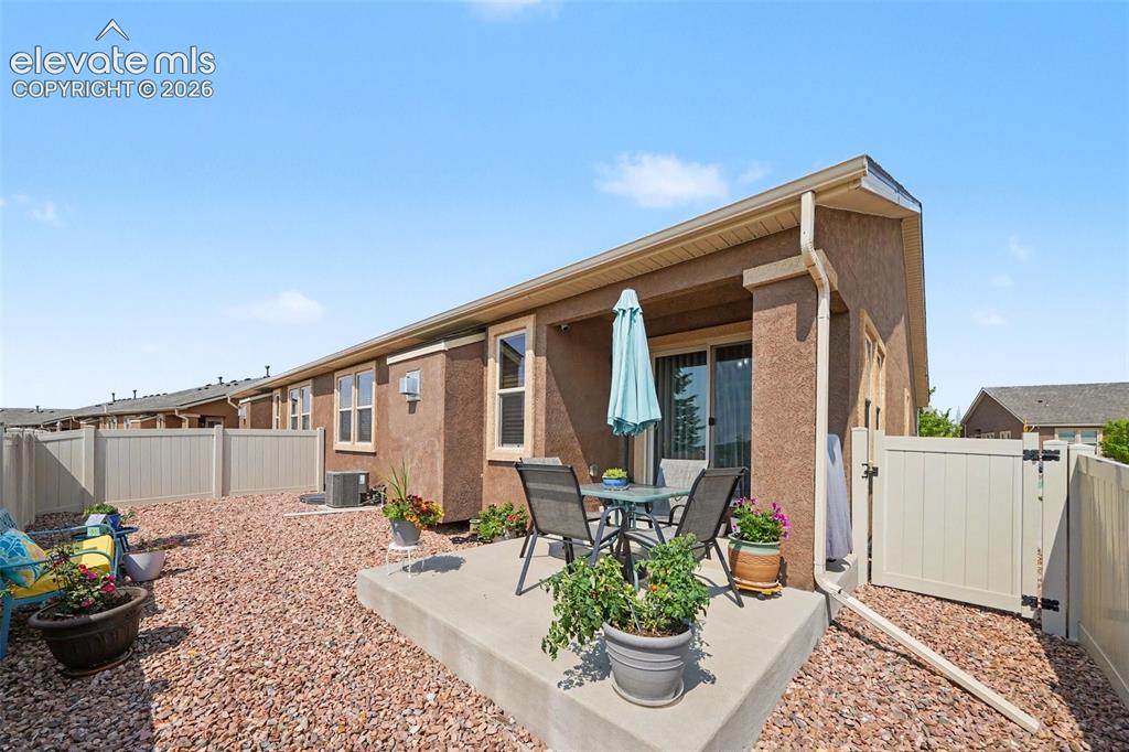 Image 22 of 32: Low-maintenance outdoor living at its best with a private xeriscaped backya