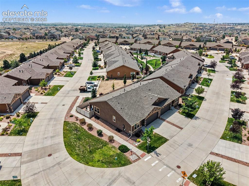 Image 26 of 32: Enjoy effortless curb appeal with a beautifully maintained front yard, matu