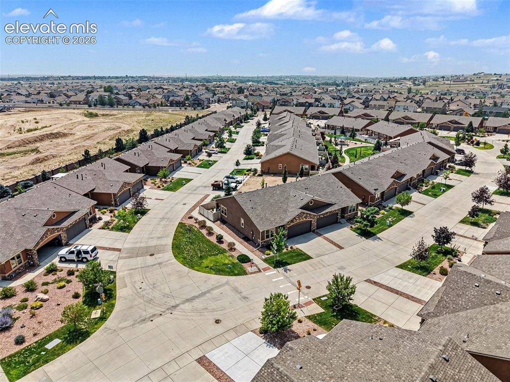 Image 29 of 32: The corner lot setting provides a spacious feel, better separation from nei