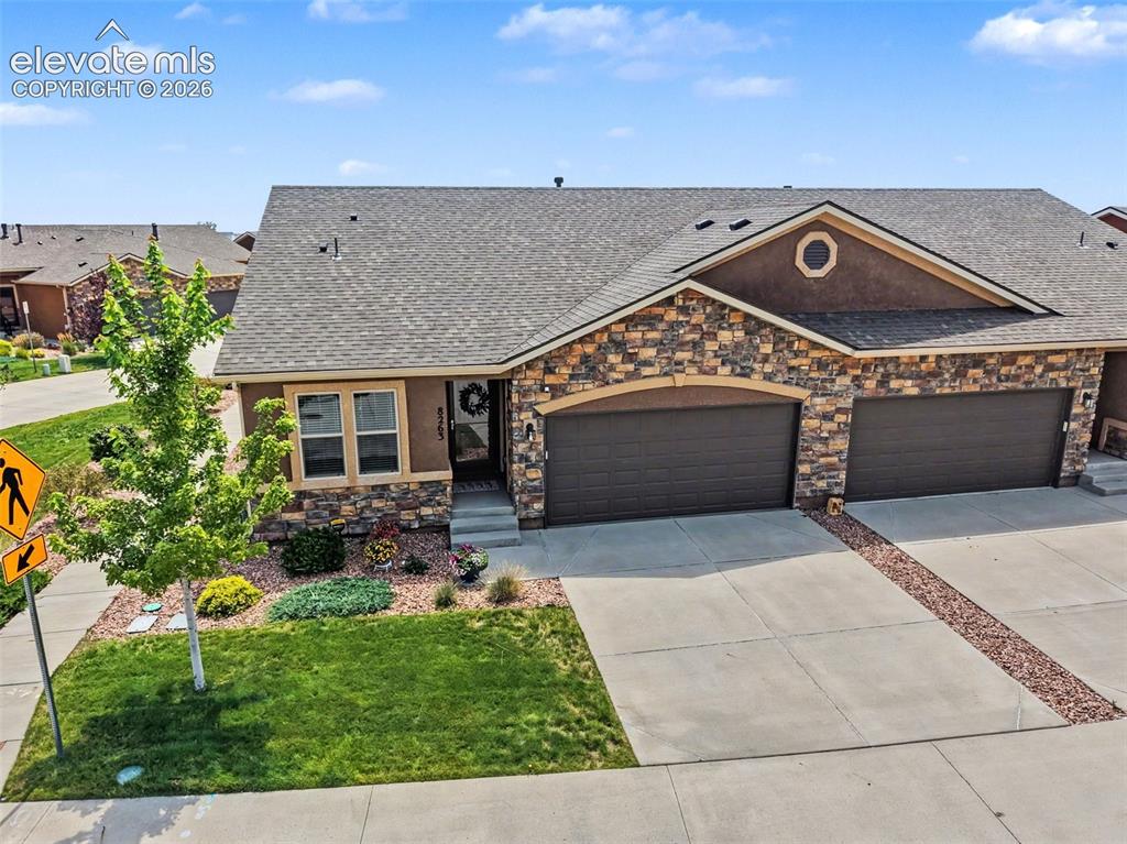 Image 5 of 32: The welcoming front entry and attractive landscaping make this home stand o