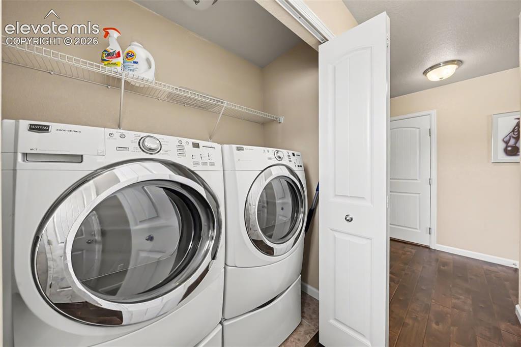 Image 8 of 32: Convenient main-level laundry room, thoughtfully located for everyday ease