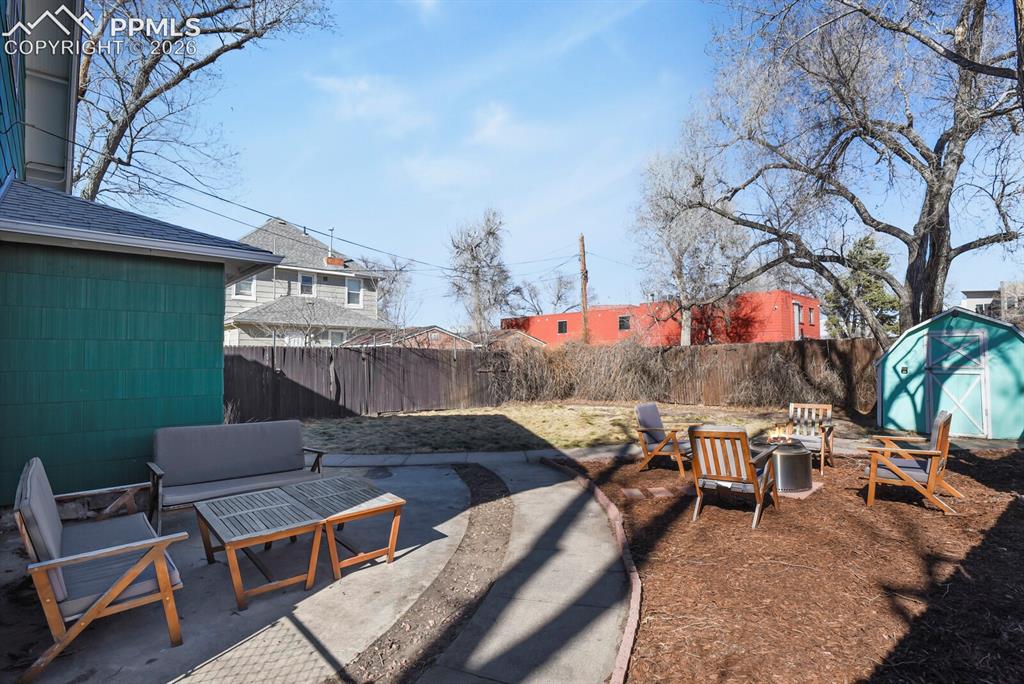 Image 26 of 34: Spacious backyard with
concrete patio
