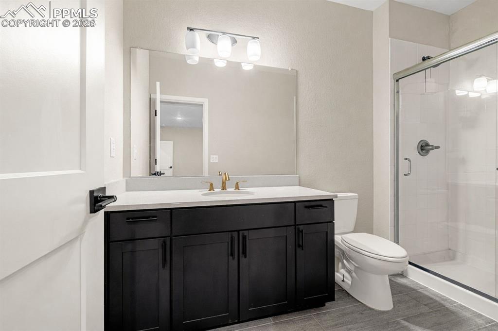 Image 21 of 38: lower level bathroom with walk in shower