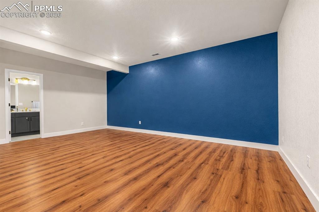 Image 24 of 38: huge lower level bedroom w/ ensuite full bathroom