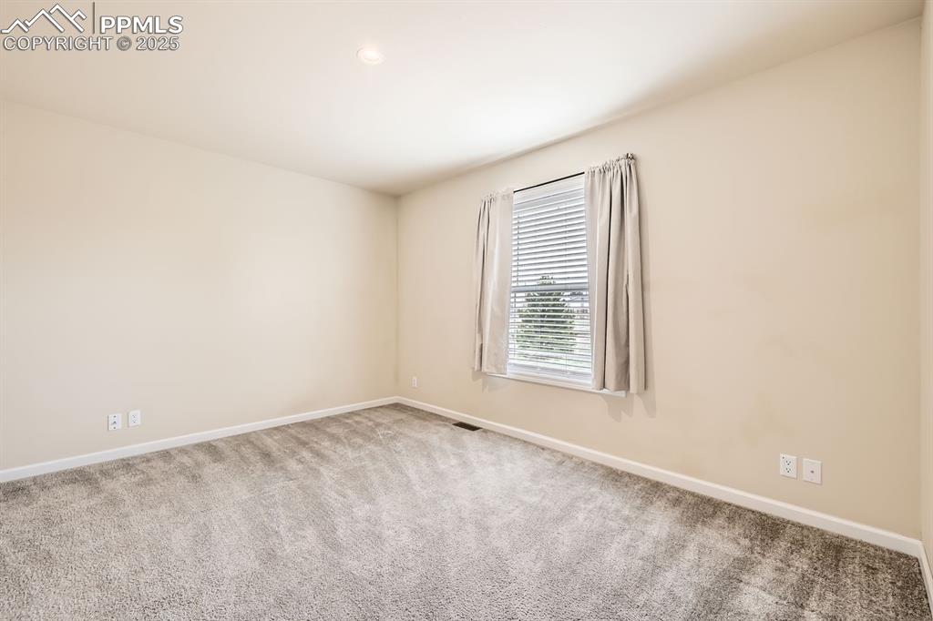 Image 23 of 41: Spare room featuring carpet flooring, recessed lighting, and baseboards