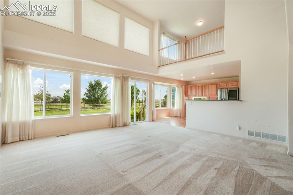 Image 11 of 50: Great Room With Slider To Patio