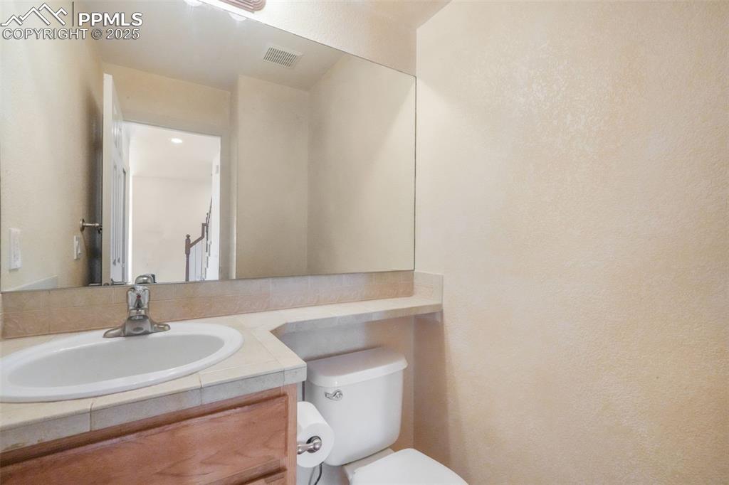 Image 17 of 50: Main Level Powder Room