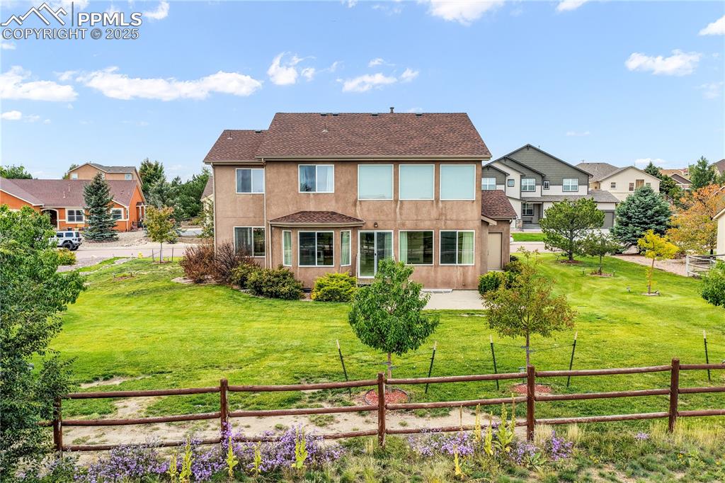 Image 43 of 50: Fenced Back Yard