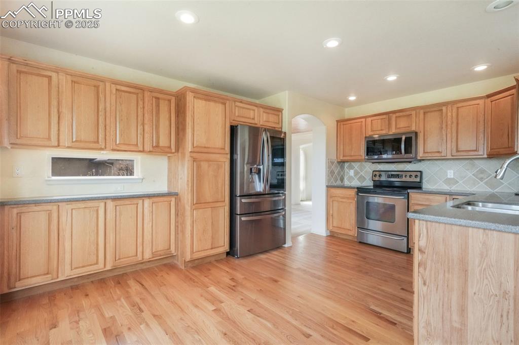 Image 5 of 50: Expansive Cabinet Storage