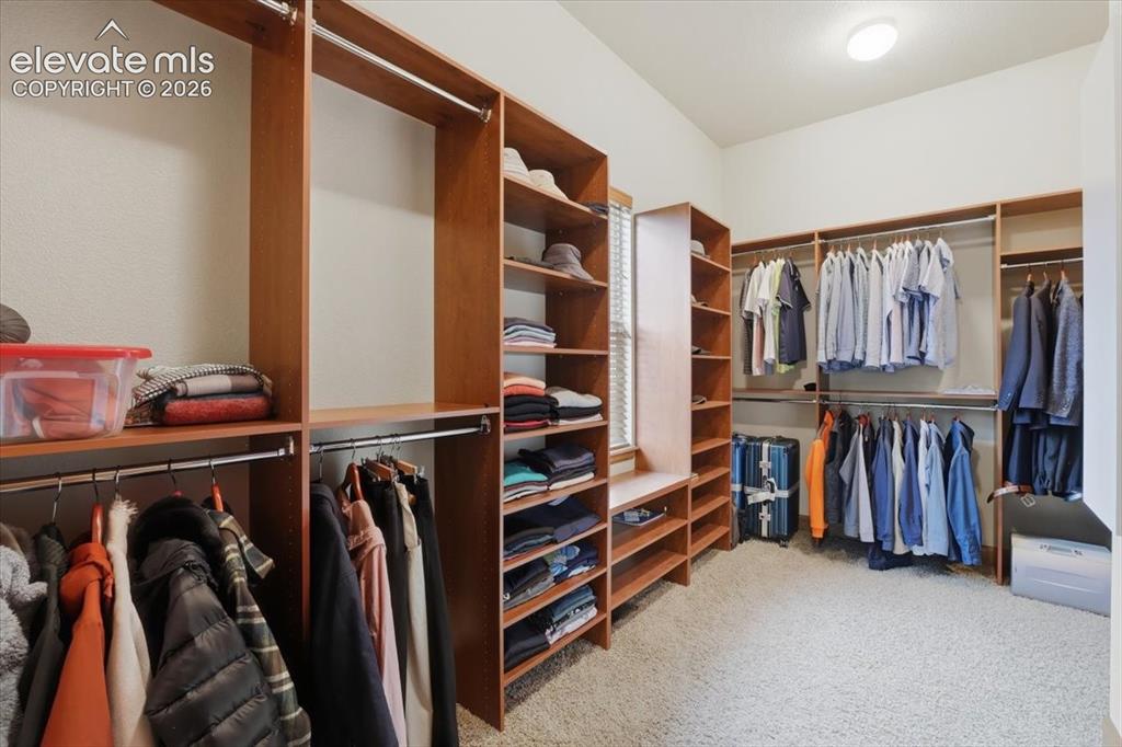 Image 16 of 32: Custom Finished Walk-in Closet!