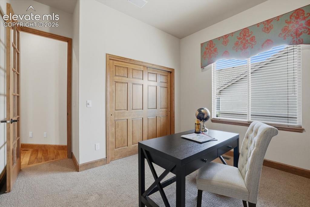 Image 18 of 32: Second Bedroom on Main Level has Built-ins and can be an Office!