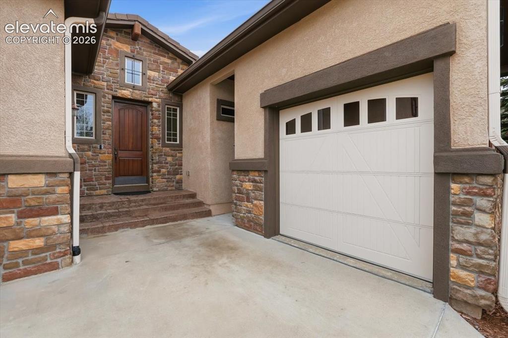 Image 2 of 32: Stone & Stucco Exterior with Tile Roof!