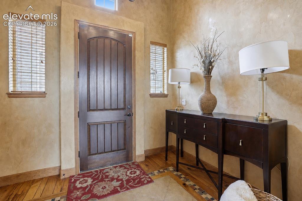Image 3 of 32: Tile and Wood flooring throughout, as well as Italian Plaster!