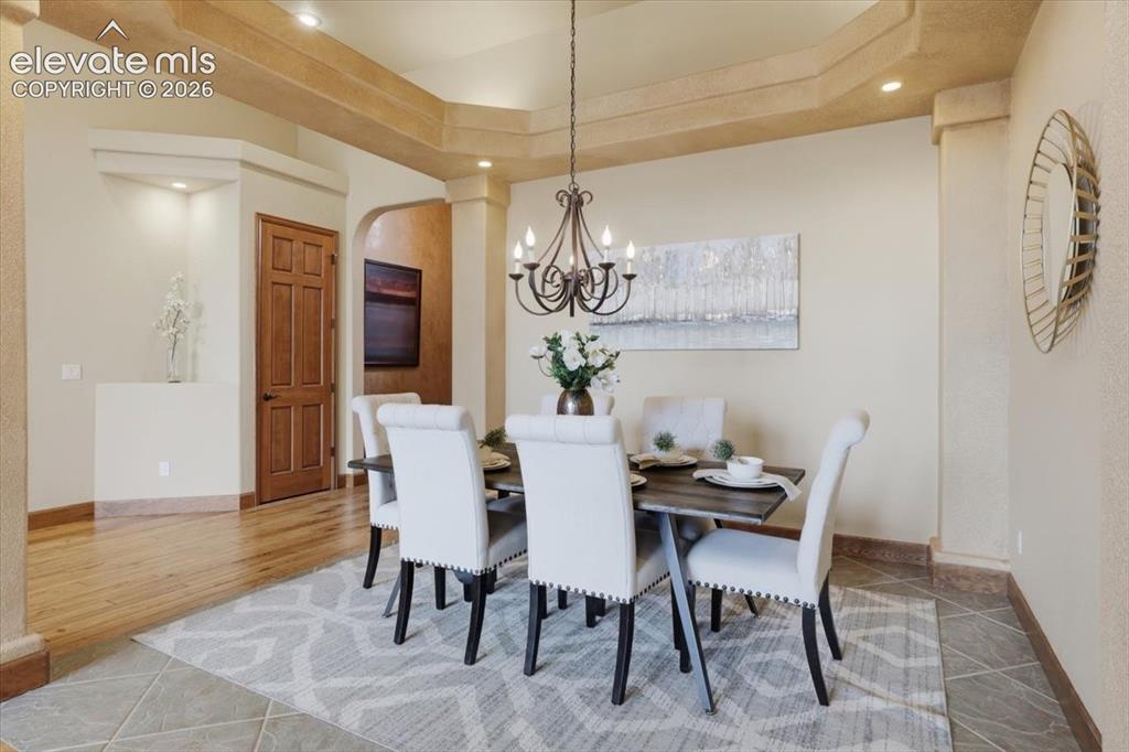 Image 4 of 32: Formal Dining with vaulted ceiling and tiled floor!