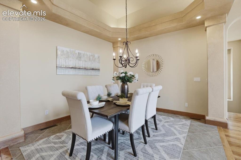 Image 5 of 32: Formal Dining with vaulted ceiling and tiled floor!