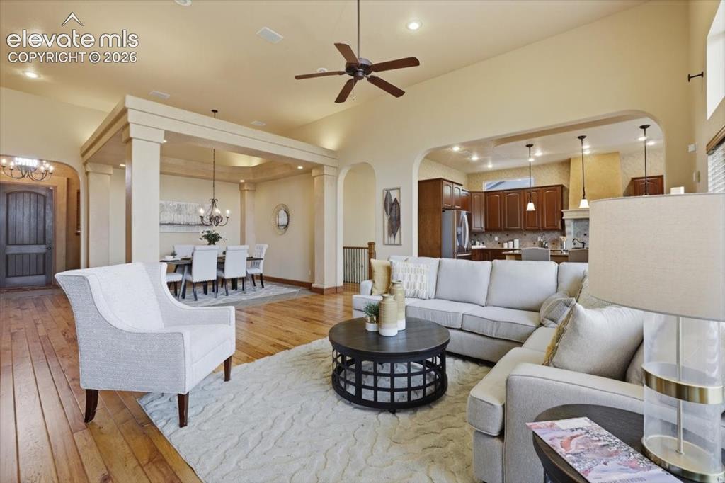Image 6 of 32: Spacious Great Room with vaulted ceiling, custom built-ins, Gas fireplace w