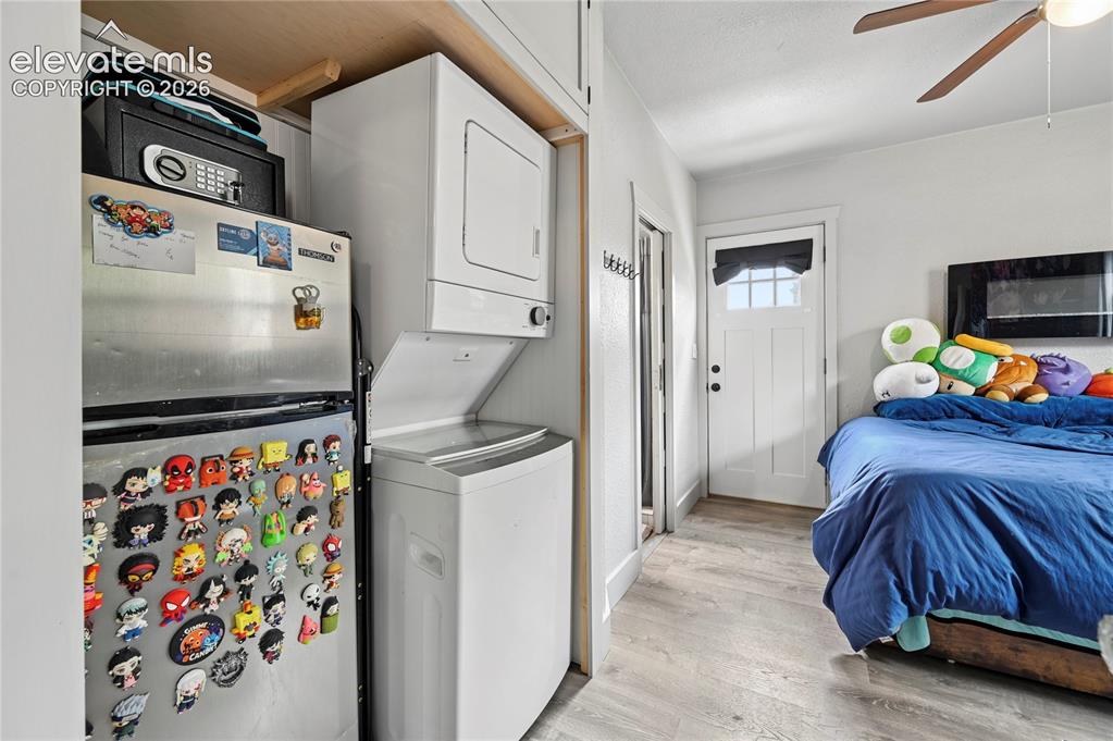 Image 13 of 50: Laundry and fridge in main floor apartment
