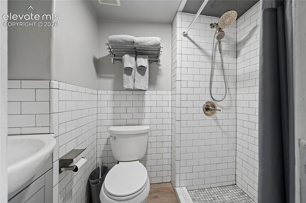 Image 15 of 50: Full bathroom in main floor apartment
