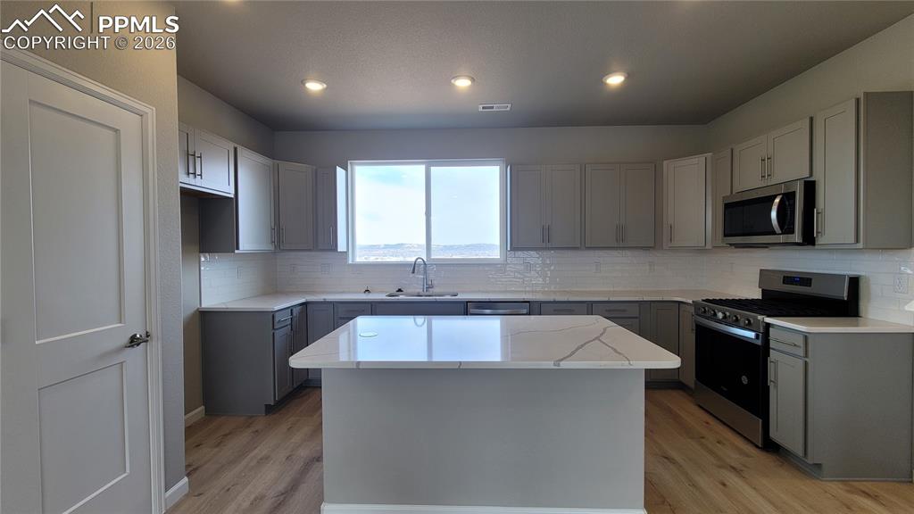 Image 10 of 24: Dining area with LVP flooring, ready to host! 