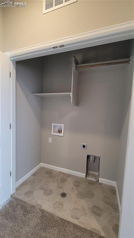 Image 18 of 24: Primary walk in closet with wood shelving and rods! 