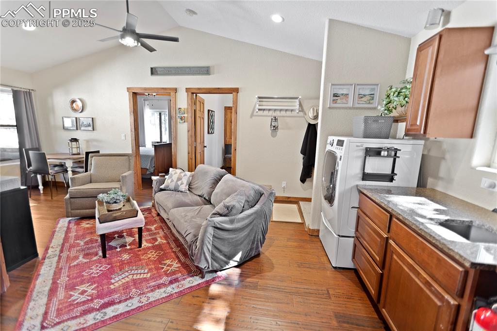 Image 19 of 39: Upper Level Living & Kitchen
