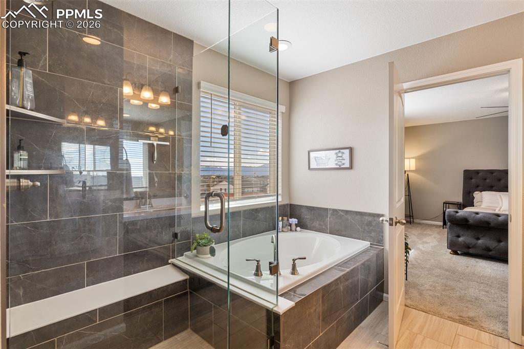 Image 24 of 49: Gorgeous frameless shower with views!