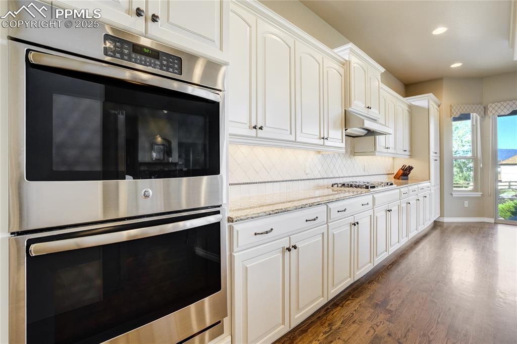 Image 13 of 50: Details matter — under-cabinet lighting, a center island, butler’s pantry, 
