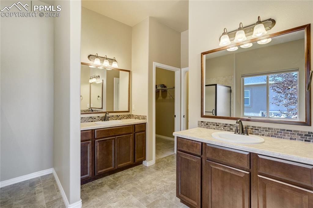 Image 26 of 50: Dual vanities, large soaking tub, walk-in shower — the kind of bathroom tha
