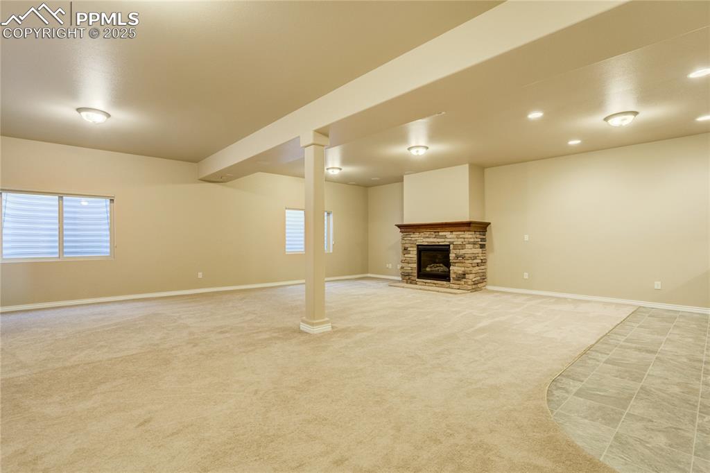 Image 32 of 50: The lower level features 9’ ceilings, surround sound, gas fireplace, and pl