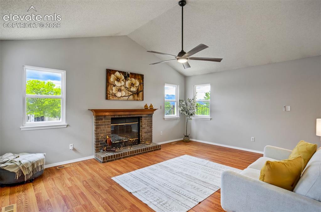 Image 5 of 47: Additional living area on main floor - with fireplace