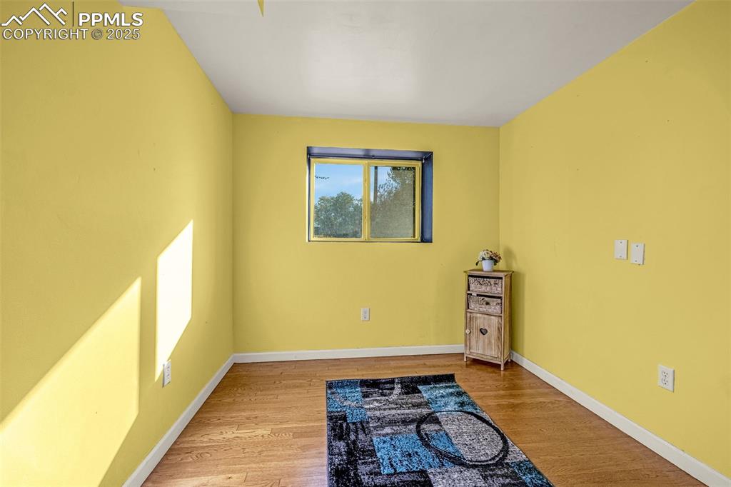 Image 20 of 33: Unfurnished room featuring light wood-style floors and baseboards