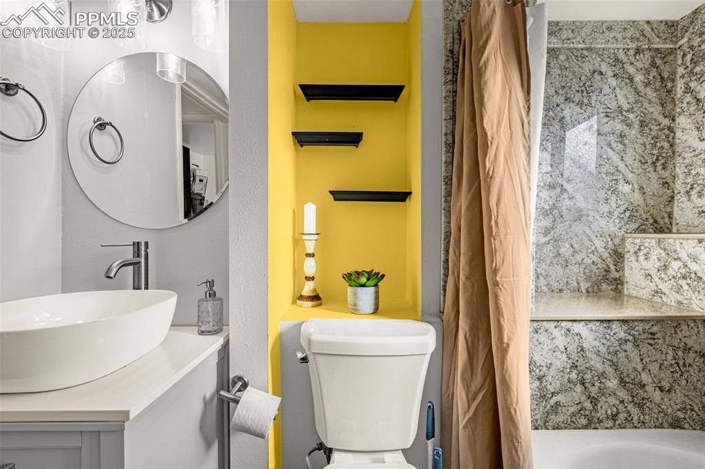 Image 21 of 33: Bathroom with vanity and toilet