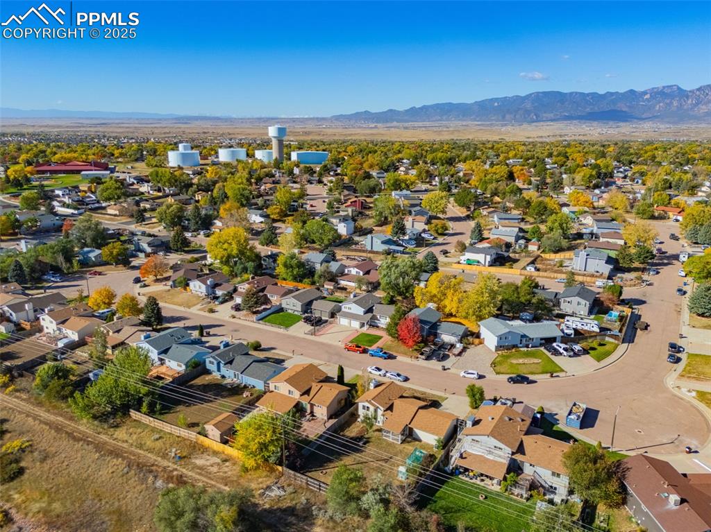 Image 31 of 33: View of property location featuring nearby suburban area and mountains