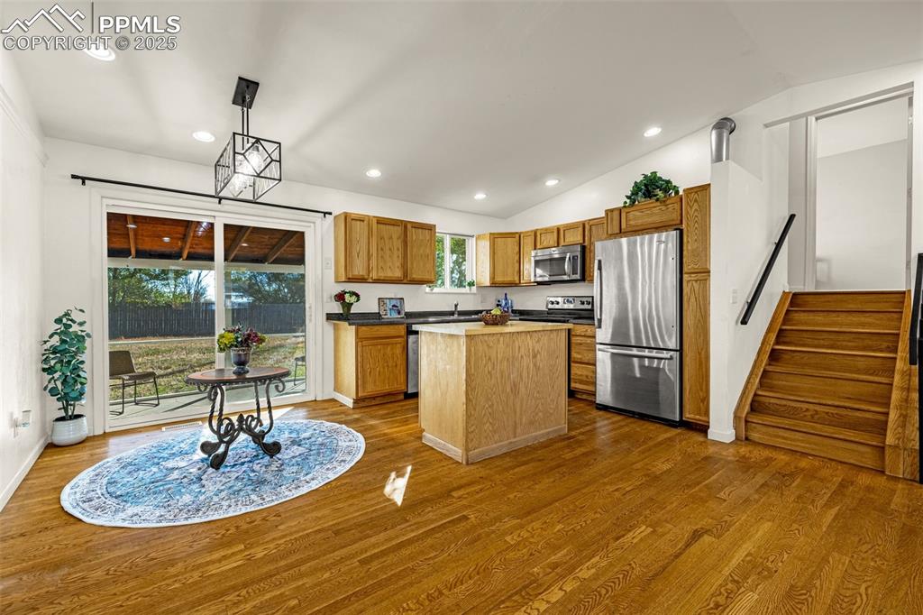 Image 9 of 33: Kitchen featuring recessed lighting, stainless steel appliances, pendant li