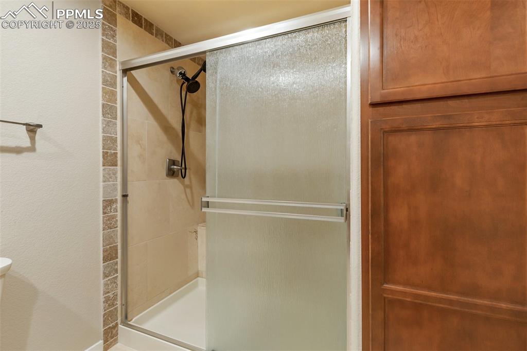 Image 32 of 46: Full bath featuring a stall shower