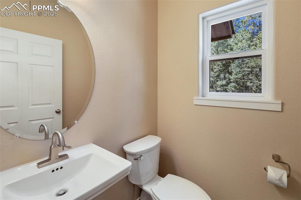 Image 34 of 46: Bathroom with a sink and toilet