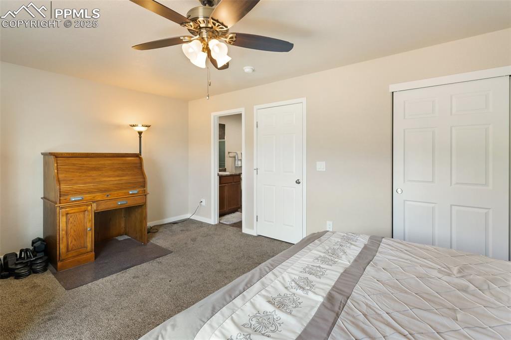 Image 43 of 46: Unfurnished bedroom with carpet, a ceiling fan, and ensuite bathroom
