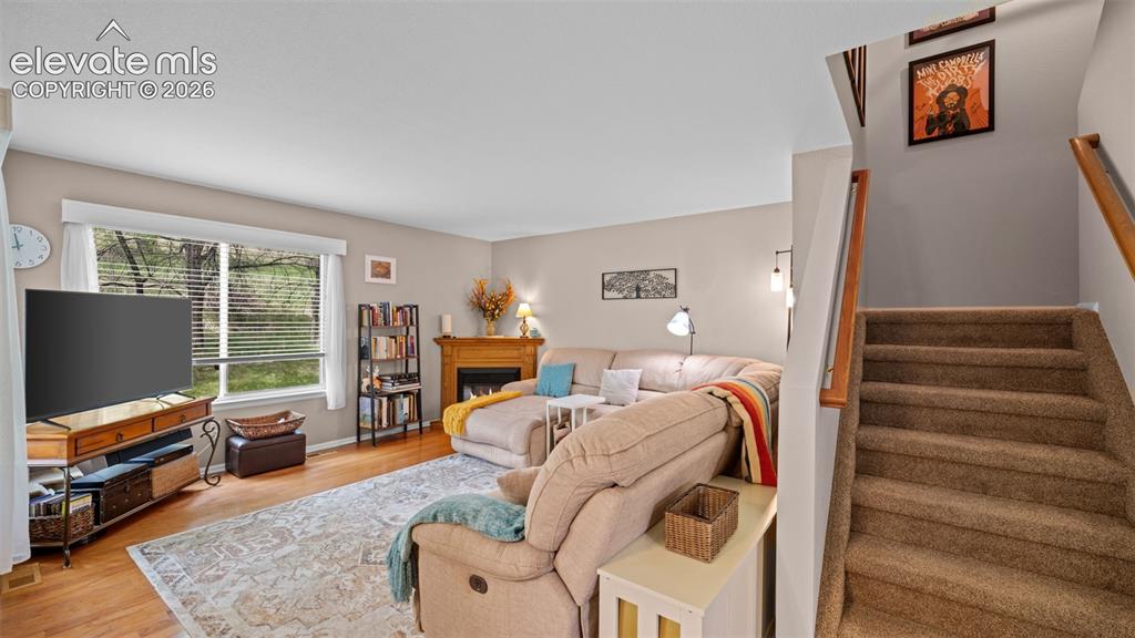 Image 12 of 28: Living Room and Stair View ~ Near New Carpet with Wrapped Stairs and Double