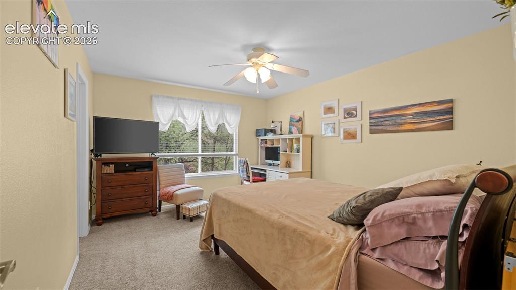 Image 15 of 28: Primary Bedroom on Back Side with Views of Nature and Wildlife