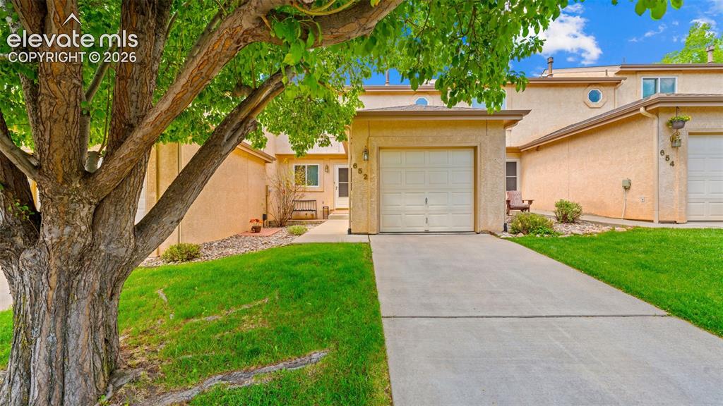 Image 21 of 28: Front Exterior Entrance and Garage with Extended Concrete Apron