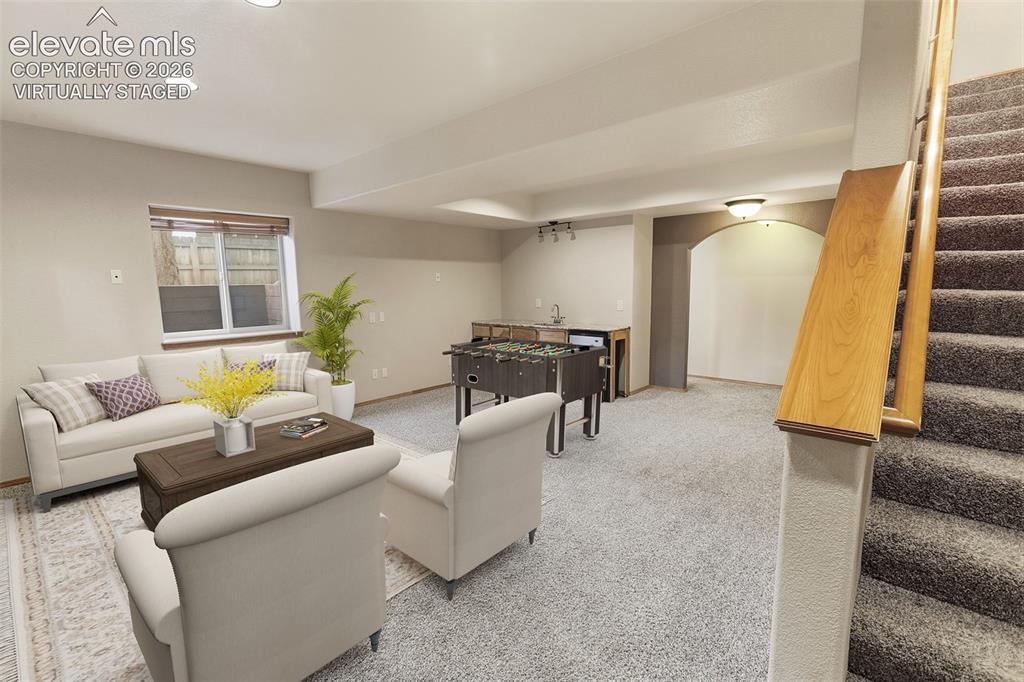 Image 16 of 40: Lower Level Family Room - Virtually Staged