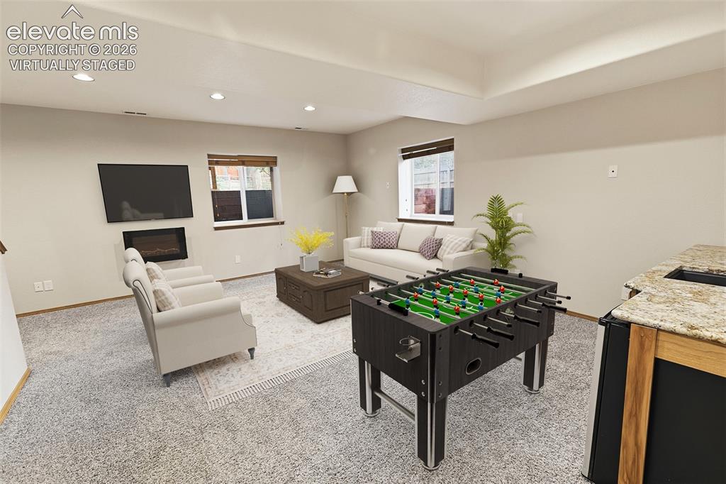 Image 17 of 40: Lower Level Family Room - Virtually Staged
