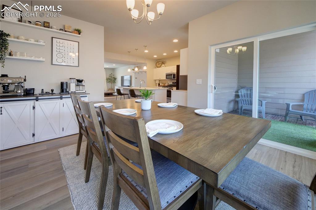 Image 14 of 38: Dining Area that walks out for convenient grilling with patio decking.