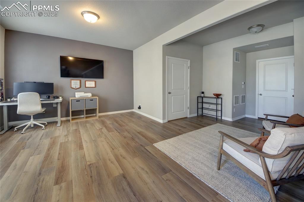 Image 2 of 38: Lower level living space with access from garage.