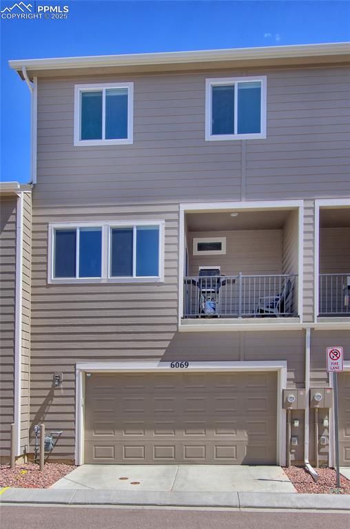 Image 34 of 38: Ample sized 2-car garage that is enabled for EV charger.