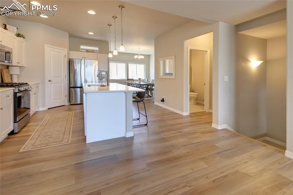 Image 6 of 38: Kitchen with Dining beyond.