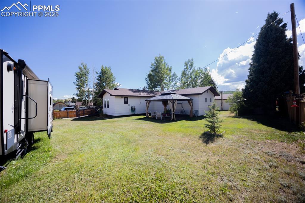 Image 23 of 34: View of yard with a gazebo