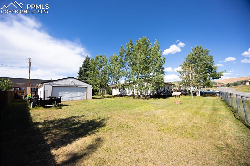 Image 24 of 34: View of yard with an outbuilding
